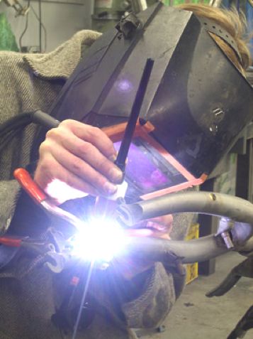Todd welding a bike frame