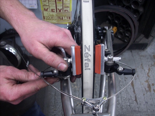 tightening down the right brake pad