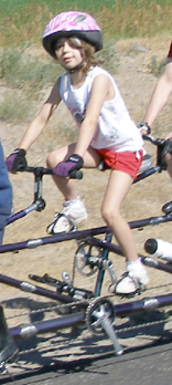 Grace on the back of a tandem using a Rodriguez Kidback