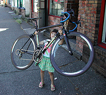 Grace Towle, 6, Lifting a Rodriguez Light Bike