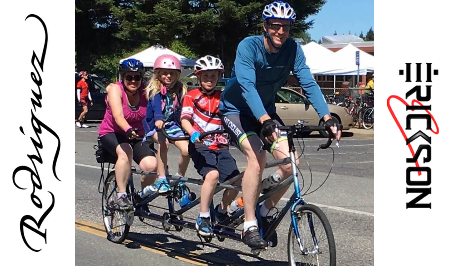 Bicycle built for 4 people with family riding it