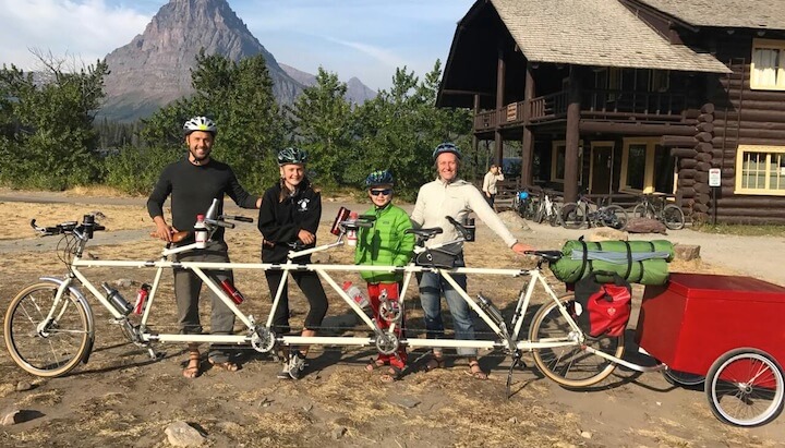 Family of four with their 4 person bike