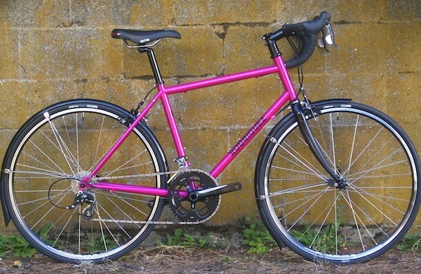 White Rodriguez touring bicycle with black script decal