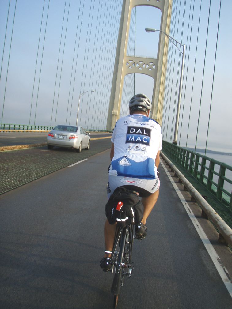 Andy on his Rodriguez crossing a bridge