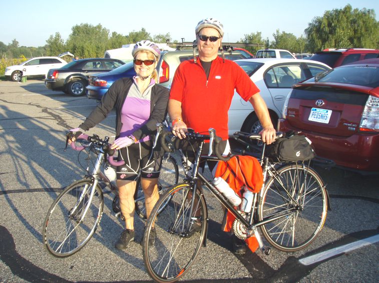 Posing with their bikes in the parking lot