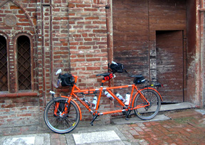 Brick Cobbles under the wheels of the couple's tandem